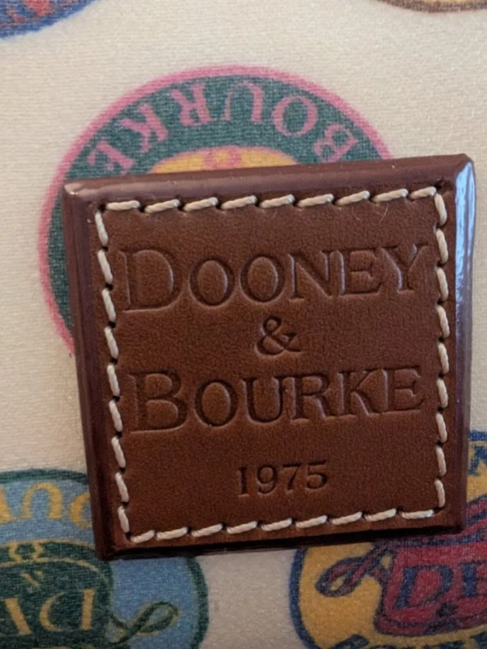 NWT Dooney & Bourke Vintage Medallion Stamp Satchel Bag Multi Color Logo